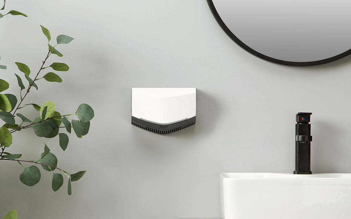 revsquared hand dryer mounted on a bathroom wall