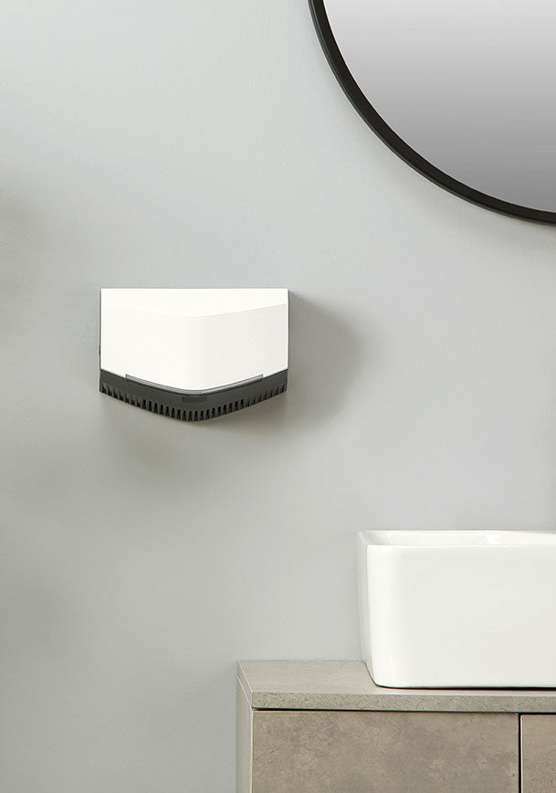 revsquared hand dryer mounted on a bathroom wall